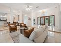 Inviting living space featuring marble floors, open layout, and views of the entryway and dining area at 1471 N Jasmine Ave, Tarpon Springs, FL 34689
