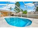 Enjoy a screened-in pool area perfect for outdoor relaxation and entertainment on sunny days at 2172 Whitewood Ave, Spring Hill, FL 34609