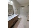 Well-lit bathroom featuring a modern vanity and a shower-tub combination at 2270 Alden Ln # A, Palm Harbor, FL 34683