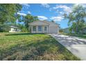 Lovely one-story home showcasing a well-maintained lawn and a cozy covered porch at 3554 Arrowhead Ave, Spring Hill, FL 34606