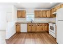 Well-lit kitchen featuring wood cabinets, granite countertops, and stainless steel appliances at 4503 Courtland St, Tampa, FL 33610