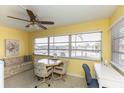 Inviting sunroom with a table, chairs, and a comfortable seating area at 5123 Topaz Ln # 206, New Port Richey, FL 34652