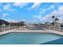 Relaxing backyard oasis with a sparkling swimming pool overlooking the waterfront at 5145 Porpoise Pl, New Port Richey, FL 34652