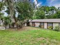 A sprawling backyard offers ample space for gardening and outdoor activities at 7119 Lenape Cir, New Port Richey, FL 34653