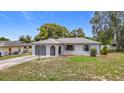 Charming single-story home with a well-maintained front yard and a one car garage at 10139 Carrin Rd, Spring Hill, FL 34608