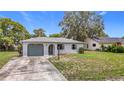 Charming single-story home with a well-maintained front yard and a one car garage at 10139 Carrin Rd, Spring Hill, FL 34608