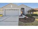 Charming single-Gathering home with a well-manicured lawn and inviting curb appeal at 11637 Spindrift Loop, Hudson, FL 34667