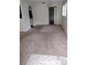 Spacious living room with plush carpeting and natural light at 11715 Boynton Ln # 74B, New Port Richey, FL 34654