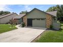 A well-maintained two-car garage and driveway provide ample parking space at 35046 Smoketree Ln, Dade City, FL 33523