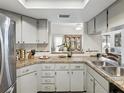 Bright kitchen with stainless steel appliances, and granite countertops at 3832 Sailmaker Ln # 3832, Holiday, FL 34691