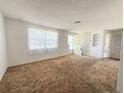 Spacious living room with large windows allowing ample natural light at 4142 Crestfield Ave, Holiday, FL 34691