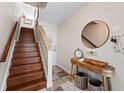 Inviting entryway boasts hardwood stairs, decorative accents, and a warm, welcoming atmosphere at 639 Garland Cir, Indian Rocks Beach, FL 33785