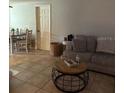 Inviting living room featuring tile flooring and cozy seating at 7222 Coventry Dr, Port Richey, FL 34668