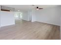 Spacious living area with new floors, freshly painted walls, and ample natural light at 7608 Bougenville Dr, Port Richey, FL 34668