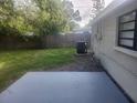 Backyard with a concrete patio and some grass at 9432 84Th St, Seminole, FL 33777