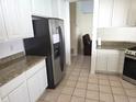 An updated kitchen featuring stainless steel appliances and granite countertops at 10244 Hoover St, Spring Hill, FL 34608