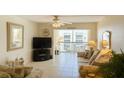Bright living room with a large window and comfortable seating area at 1243 S Martin Luther King Jr Ave # C505, Clearwater, FL 33756