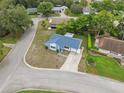 Beautiful aerial view of a corner lot home featuring a long driveway and a well-manicured lawn at 13001 Sawmill Way, Hudson, FL 34667