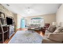 Bright living room showcasing hardwood floors, stylish furniture, and a welcoming atmosphere at 13444 English Parrot Rd, Brooksville, FL 34614