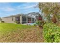 Spacious screened-in lanai and pool provide the perfect outdoor oasis at 17679 Garsalaso Cir, Brooksville, FL 34604