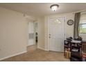 Functional foyer with tiled floors, ample storage and natural light from window at 3140 Bahia Ave, Holiday, FL 34690