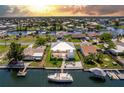 Stunning waterfront home with boat dock and lift, surrounded by lush landscaping and picturesque canals at 4469 Bahama Dr, Hernando Beach, FL 34607