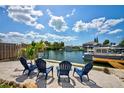 Enjoy waterfront living with these chairs placed perfectly to maximize views of the canal and boat dock at 4469 Bahama Dr, Hernando Beach, FL 34607