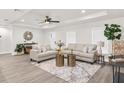 Bright living room featuring neutral tones, recessed lighting, and large windows that flood the space with natural light at 4479 Bluewater Ave, Spring Hill, FL 34606