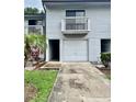 Charming two-story townhome with a one-car garage and a small balcony on the second level at 6462 92Nd N Pl # 806, Pinellas Park, FL 33782