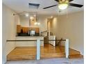 Living room showcasing hardwood floors and a ceiling fan at 6462 92Nd N Pl # 806, Pinellas Park, FL 33782