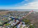An aerial view of a waterfront community with navigable waterways and neighborhood layout at 7303 Hatteras Dr, Hudson, FL 34667