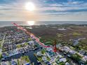 Aerial view of home in waterfront community with access to Gulf of Mexico at 7303 Hatteras Dr, Hudson, FL 34667
