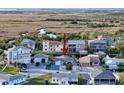 Aerial view shows home's proximity to waterfront with access to Gulf of Mexico at 7303 Hatteras Dr, Hudson, FL 34667