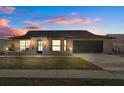 Charming single-story home showcasing a well-maintained lawn and attached two-car garage at 8914 Schrader Blvd, Port Richey, FL 34668