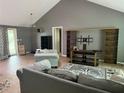 Open living room featuring a neutral color palette and lots of natural light at 9155 Pemberton St, Spring Hill, FL 34608