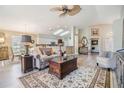 Comfortable living room adjacent to kitchen and dining area; great layout for entertaining at 1242 Almondwood Dr, Trinity, FL 34655