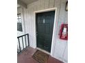 A close up shot of a condo door with the unit number and a fire extinguisher at 203 Pine Violet Ct # 202, Tampa, FL 33612