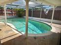 Sparkling, screened-in pool offers a private oasis for relaxation and recreation at 3206 Pinon Dr, Holiday, FL 34691