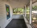Enclosed porch with pane windows and exterior view at 3415 N 51St St, Tampa, FL 33619