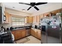 Efficient kitchen featuring stainless steel appliances, oak cabinetry, and granite countertops at 6795 23Rd S St, St Petersburg, FL 33712