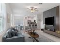Stylish open-concept living room that includes modern design elements and lots of natural light at 8305 Crescent Oaks Dr, New Port Richey, FL 34655