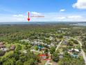 Aerial view of the property showcasing its location near the Gulf of America and surrounding lush greenery at 8340 Saint Marks Ct, Hudson, FL 34667