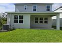 A large backyard with a covered porch, perfect for outdoor relaxation at 14441 Maiden Ter, Lakewood Ranch, FL 34211