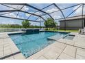 Beautiful screened-in pool offers a refreshing retreat with a serene lake backdrop at 1783 Oak Hammock Ct, Lutz, FL 33558