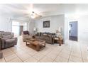 Spacious living room features tile flooring, neutral tones, and comfortable seating at 22348 Olean Blvd, Port Charlotte, FL 33952