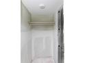 Walk-in closet with shelf awaits customization to maximize storage space at 4754 Marine Pkwy # 103, New Port Richey, FL 34652