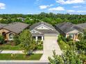 Birds eye view of a well-maintained single story home with lush backyard and inviting curb appeal at 6130 Colmar Pl, Apollo Beach, FL 33572