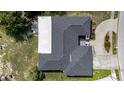 Aerial view of home featuring a well-maintained roof and landscaping at 7133 Box Elder Dr, Port Richey, FL 34668