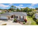 Charming one-story home with a well-maintained lawn, a well-manicured lawn, and inviting curb appeal at 7133 Box Elder Dr, Port Richey, FL 34668