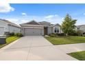 Charming single-Gathering home with a well-manicured lawn and a two-car garage at 1098 Old Windsor Way, Spring Hill, FL 34609